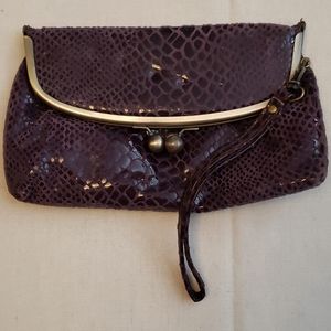 Wristlet purple leather snake print.
